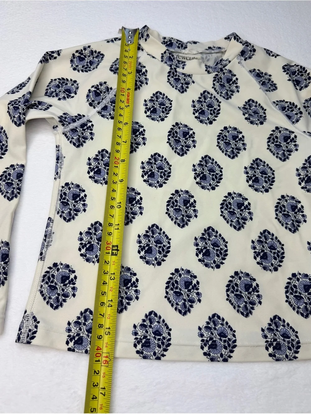 J.Crew long-sleeve rash guard featuring an all-over navy and white floral 6-7